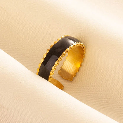 ŒIL DE FEU – Bague en acier inoxydable plaqué or avec émail noir