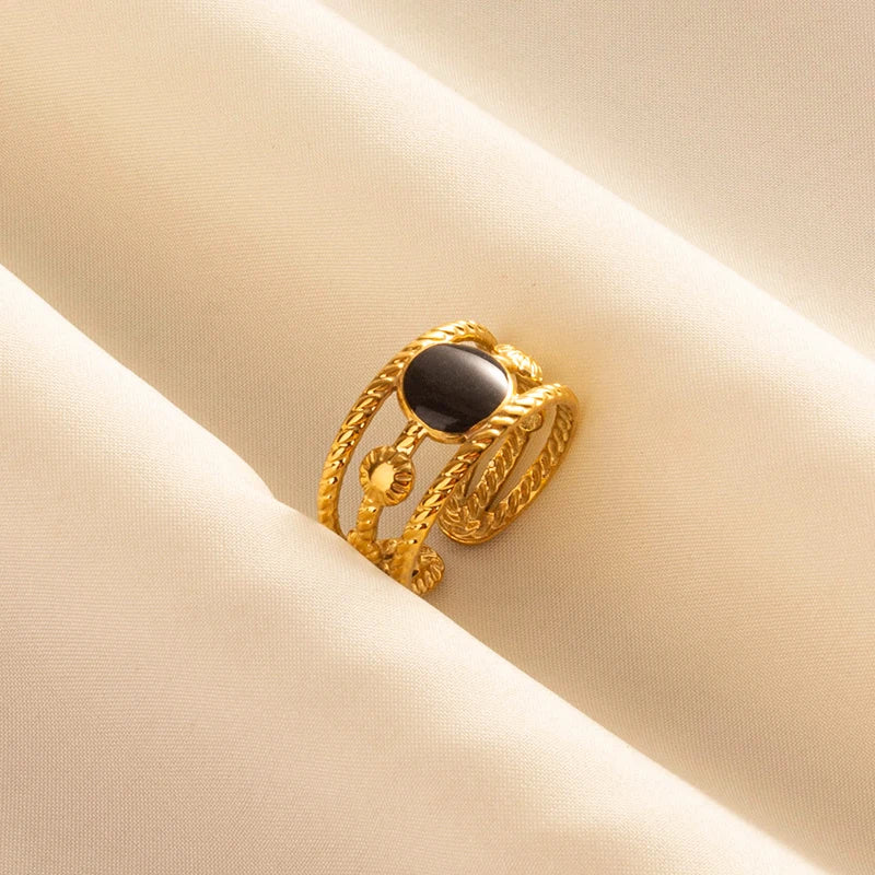 ŒIL DE FEU – Bague en acier inoxydable plaqué or avec émail noir